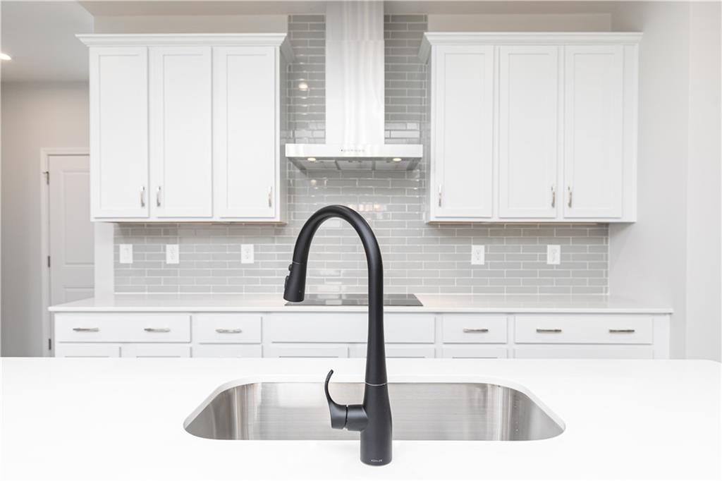 329 Cavalier Lane Acworth, GA 30102 - Photo 8 of 58 a kitchen with a sink and a microwave