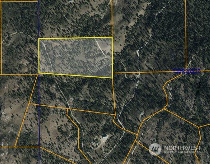 a view of outdoor space with wooden floor