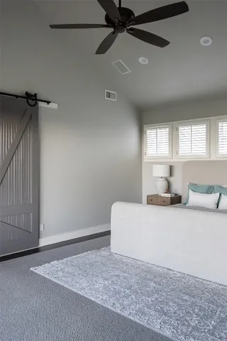 a living room with a bed furniture and a window