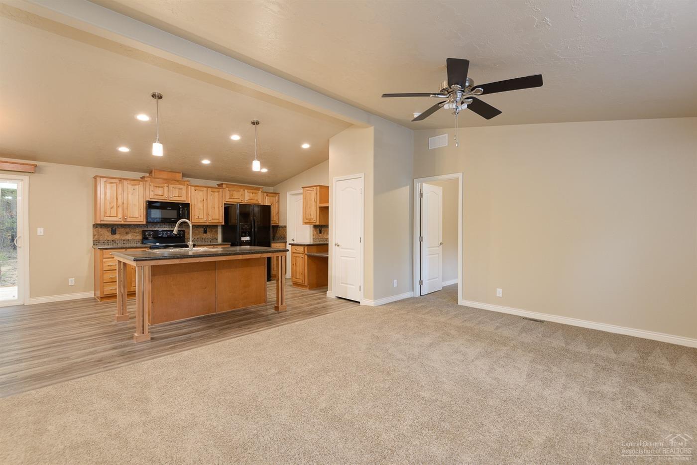 17237 Jacinto Road Bend, OR 97707 - Photo 13 of 20 a view of kitchen with stainless steel appliances refrigerator oven and white cabinets