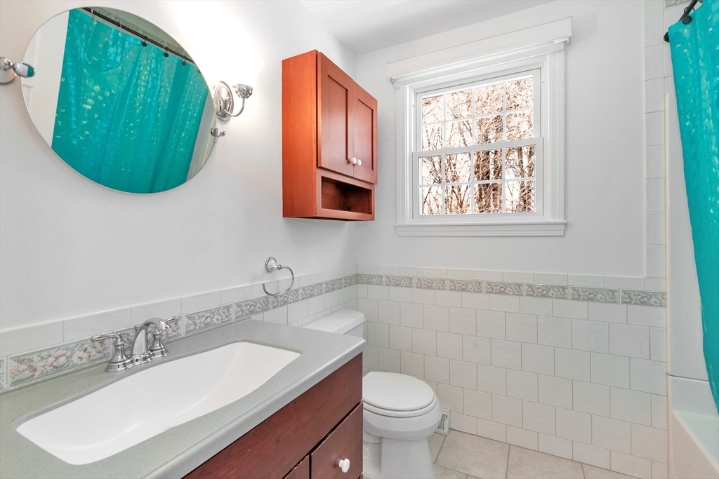 6 Blueberry Hill Road Groveland, MA 01834 - Photo 27 of 39 a bathroom with a toilet sink and mirror