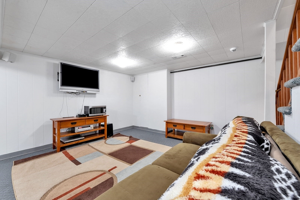 6 Blueberry Hill Road Groveland, MA 01834 - Photo 29 of 39 a bedroom with furniture and a flat screen tv