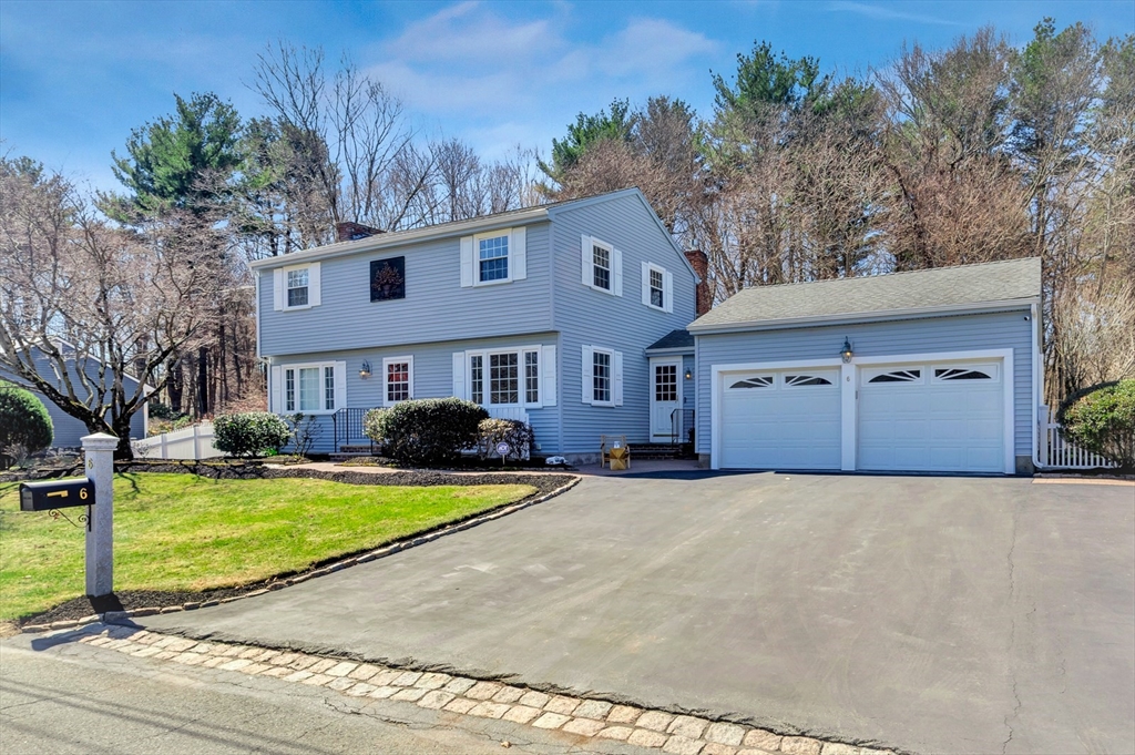 6 Blueberry Hill Road Groveland, MA 01834 - Photo 3 of 39 a front view of a house with a yard and garage