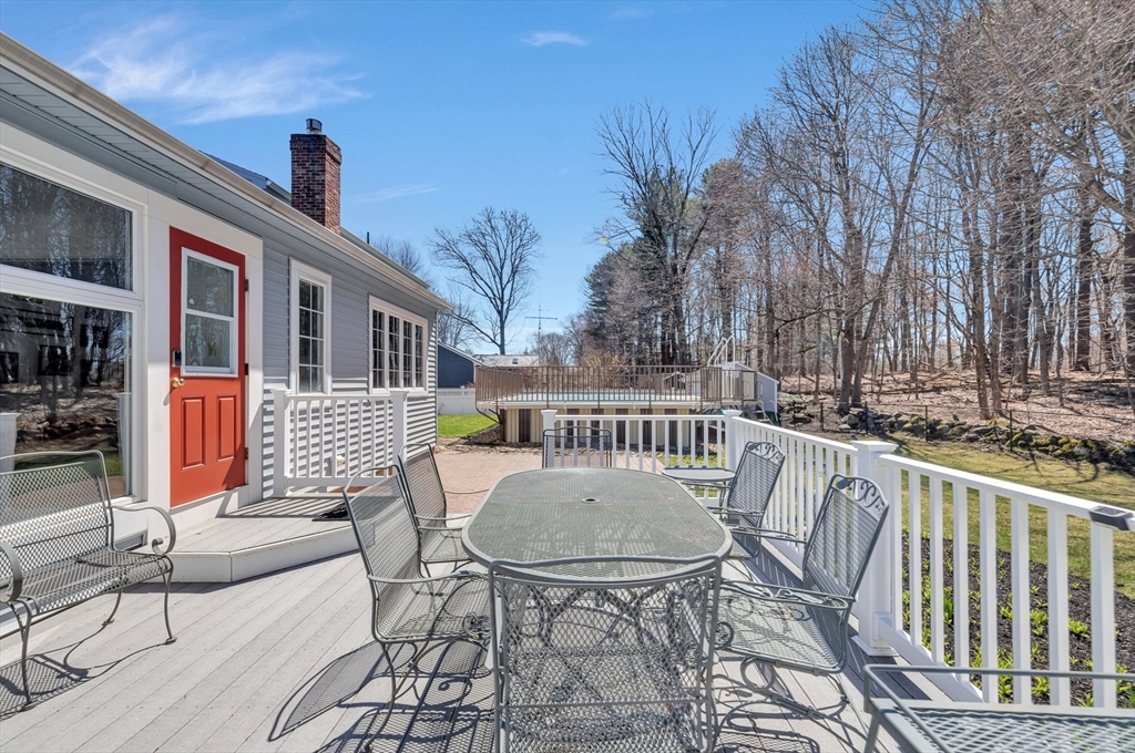 6 Blueberry Hill Road Groveland, MA 01834 - Photo 34 of 39 a view of a patio with a table and chairs