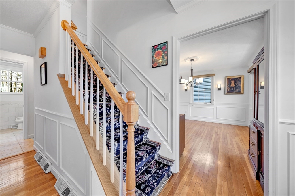 6 Blueberry Hill Road Groveland, MA 01834 - Photo 5 of 39 a view of staircase with wooden floor and a chandelier