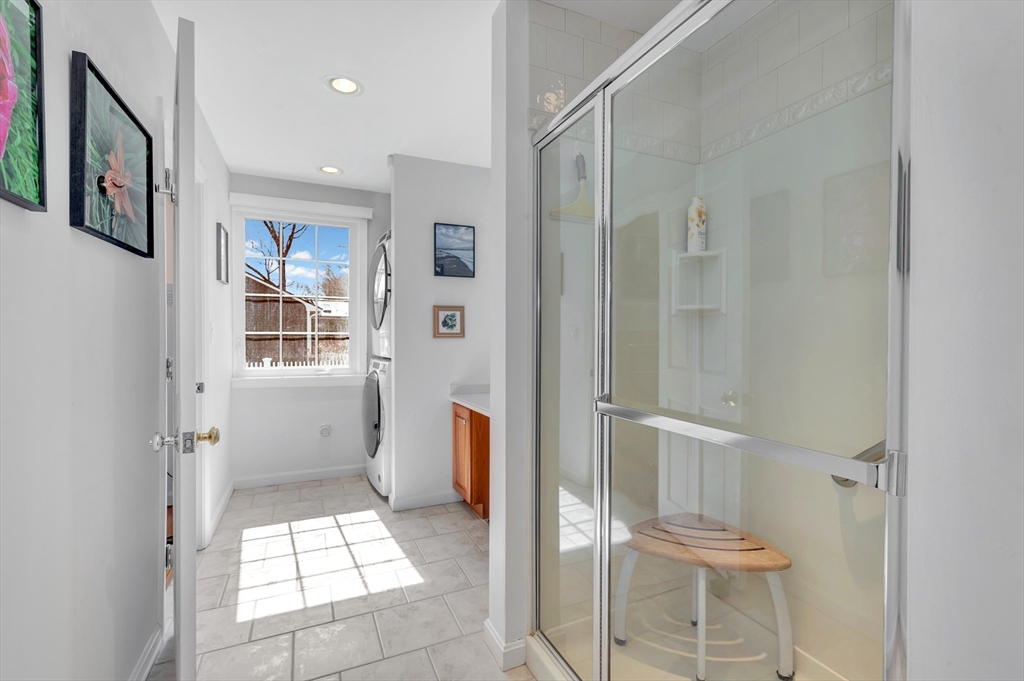 6 Blueberry Hill Road Groveland, MA 01834 - Photo 9 of 39 a bathroom with a glass door shower a toilet and a sink