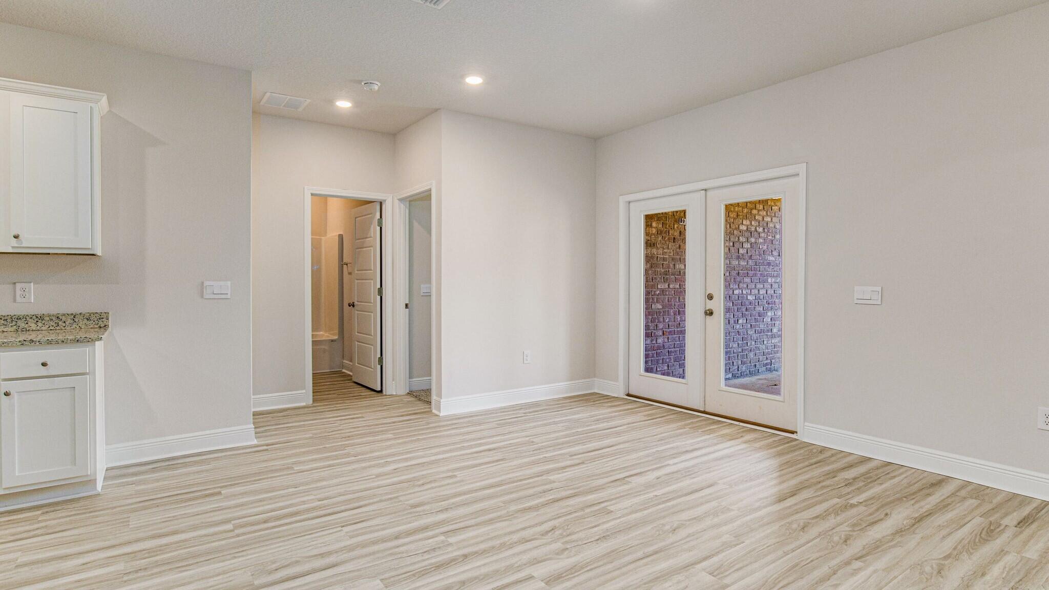 8652 Bluebell Street Milton, FL 32583 - Photo 10 of 25 an empty room with wooden floor & closet area