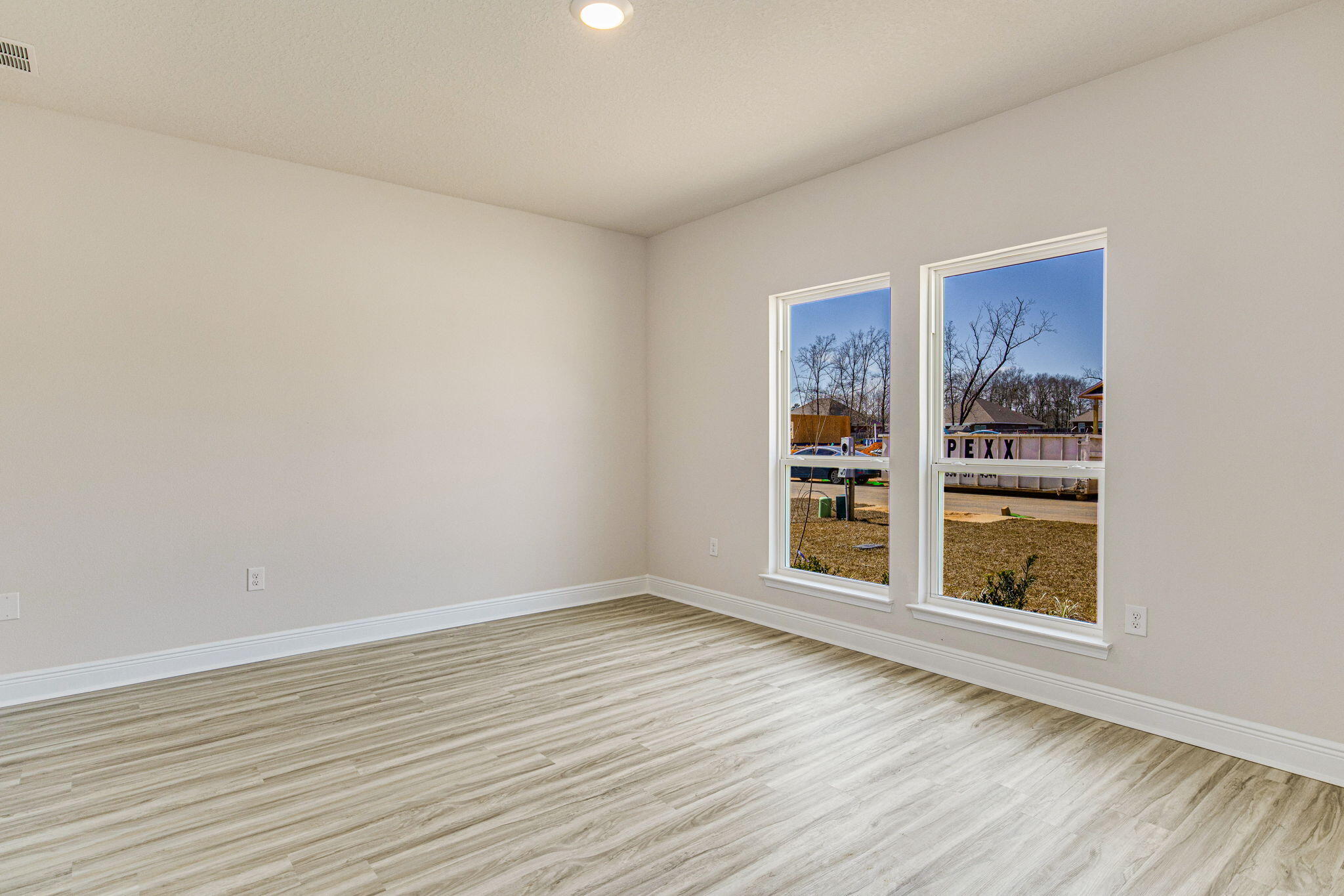 8652 Bluebell Street Milton, FL 32583 - Photo 13 of 25 wooden floor in an empty room with a window