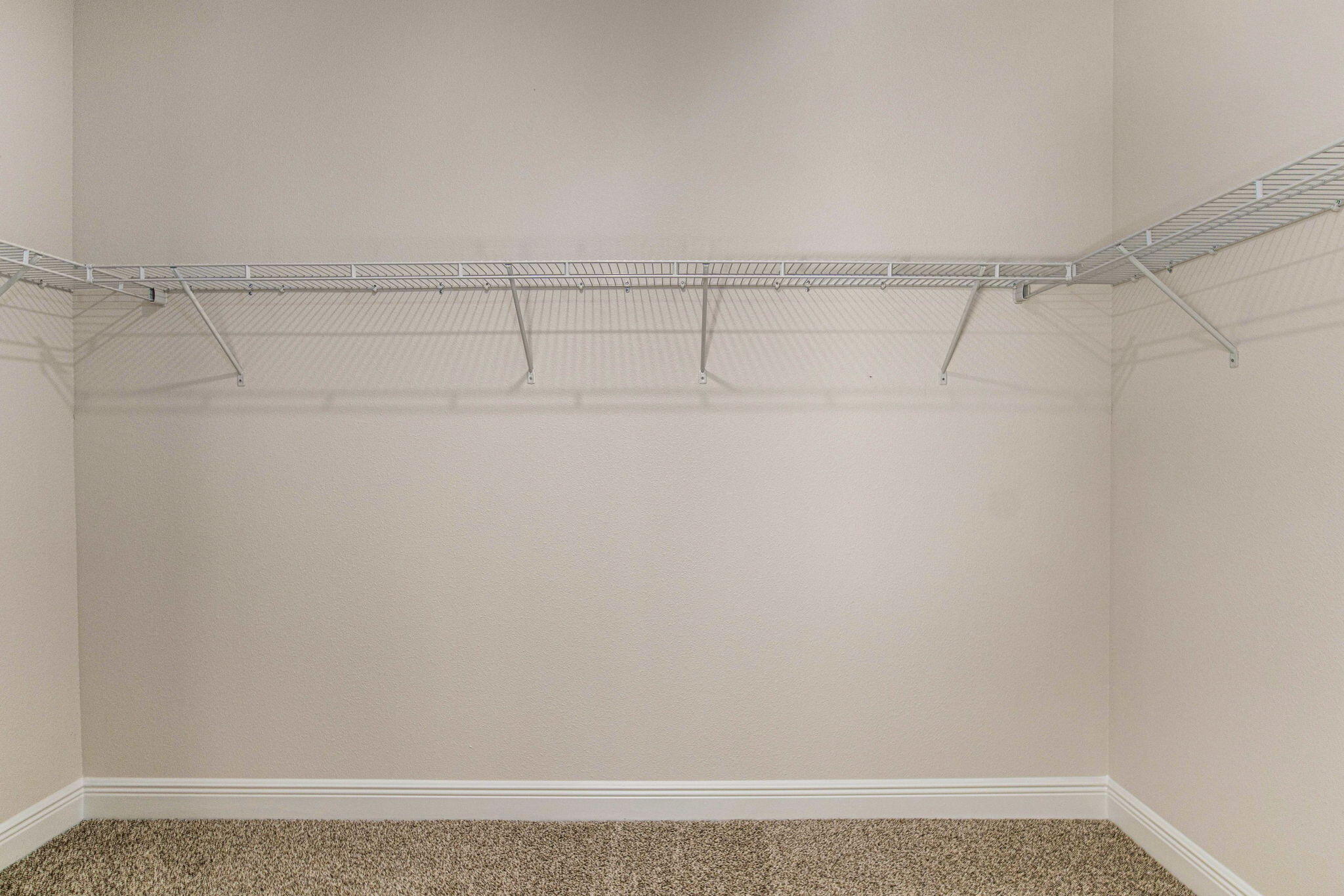 8652 Bluebell Street Milton, FL 32583 - Photo 18 of 25 a view of a room with racks on the wall