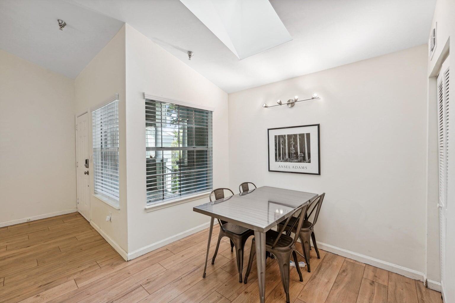 1050 Crystal Way, Unit L Delray Beach, FL 33444 - Photo 7 of 13 a view of a dining room with furniture window and wooden floor