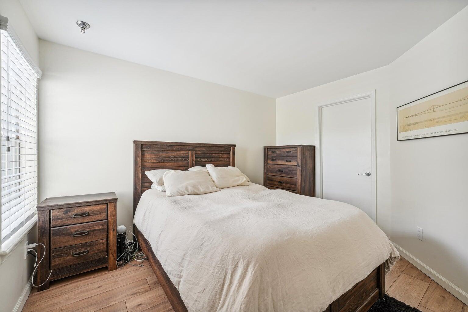 1050 Crystal Way, Unit L Delray Beach, FL 33444 - Photo 8 of 13 a bedroom with a bed and dresser
