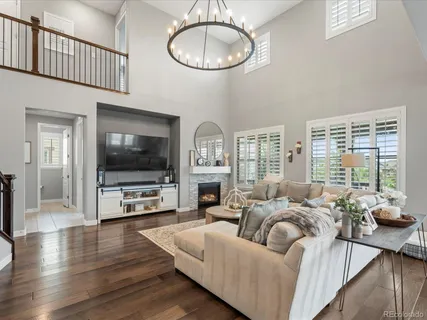a living room with furniture fireplace and a flat screen tv