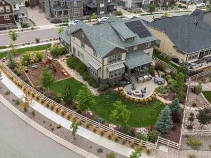 an aerial view of residential houses with outdoor space