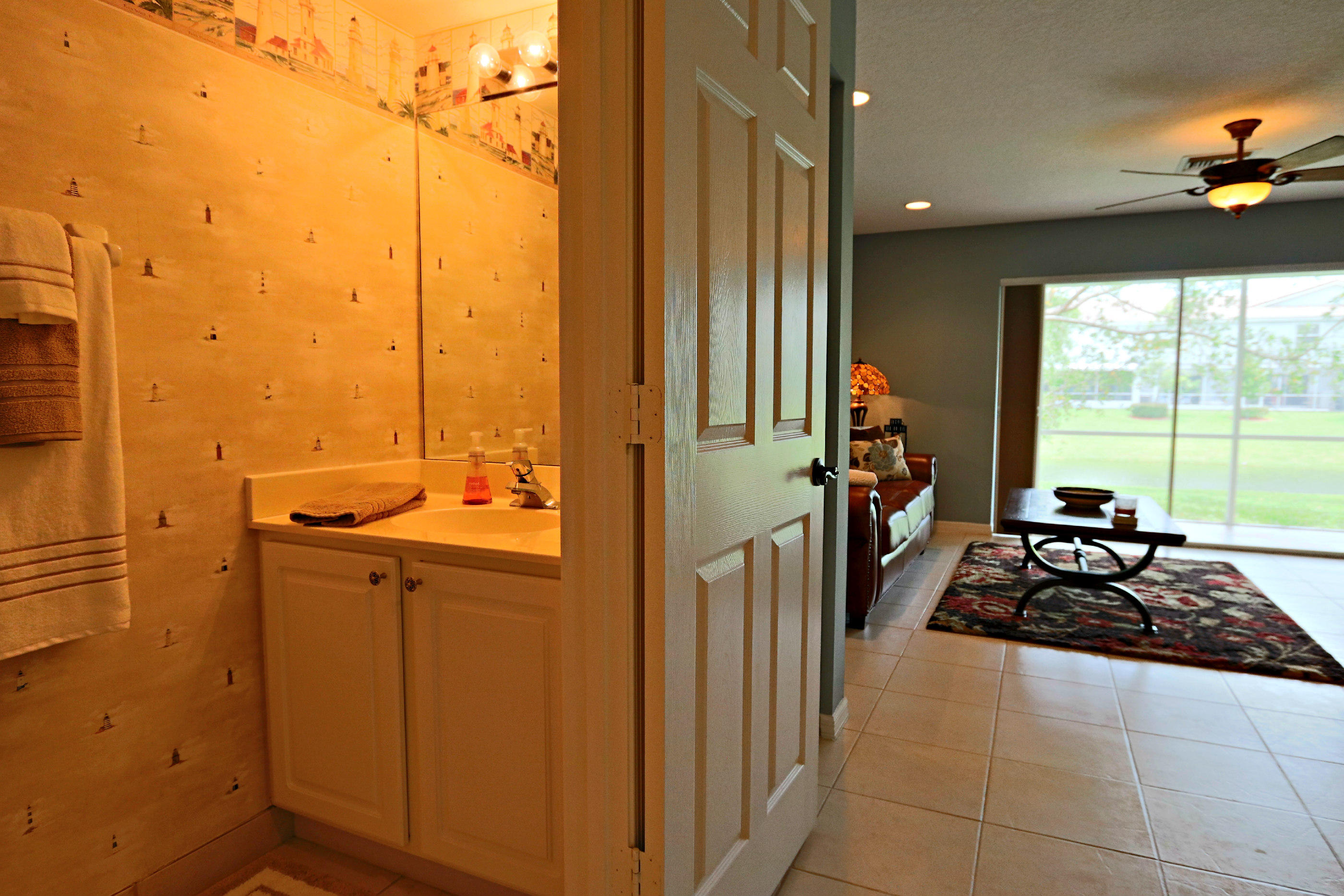 312 Timberwalk Trail Jupiter, FL 33458 - Photo 7 of 27 Power Room Off Living Area.