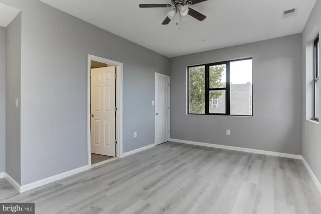a view of an empty room with a window