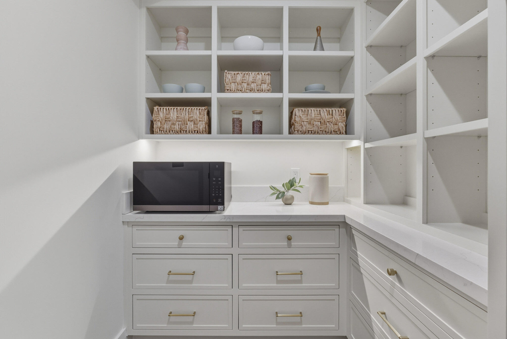 210 Las Alturas Road Santa Barbara, CA 93103 - Photo 46 of 61 a kitchen with white cabinets and a wooden floor