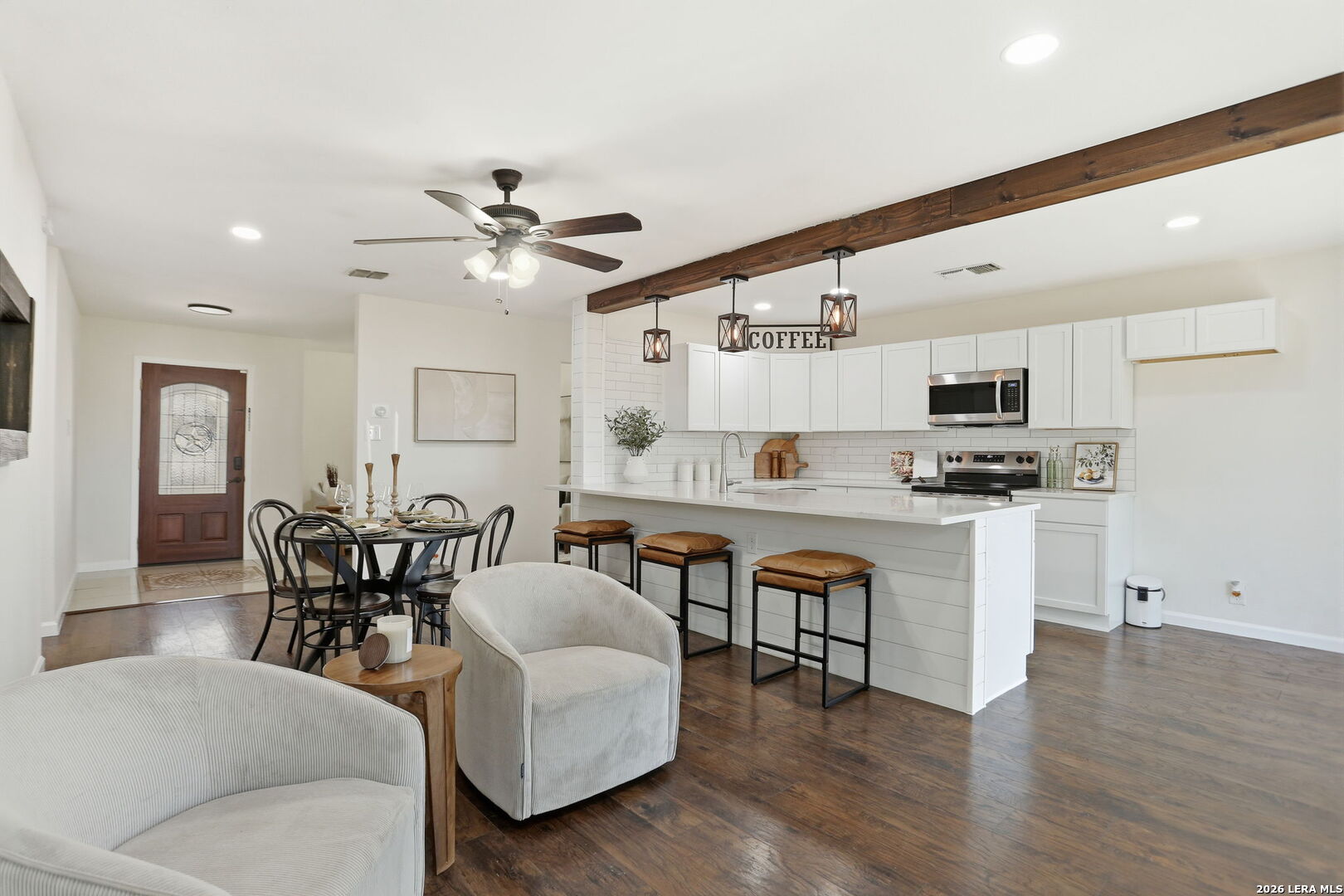 7106 Comanche Ridge Drive Converse, TX 78109 - Photo 20 of 36 a open kitchen with white cabinets and stainless steel appliances