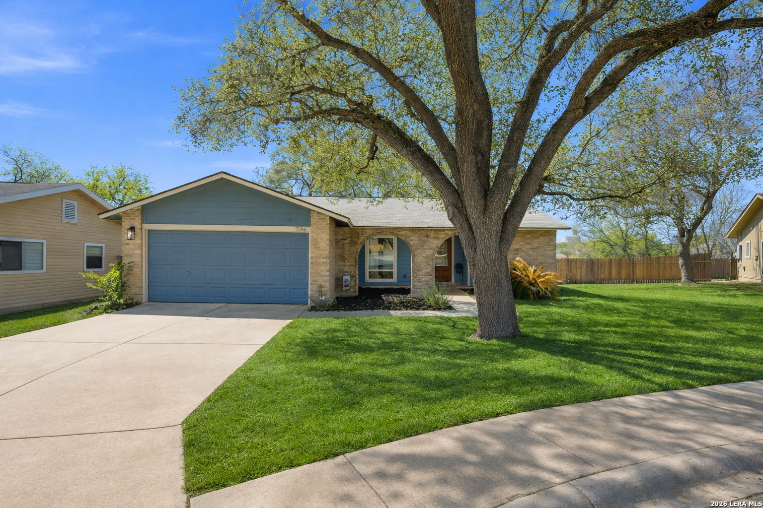 7106 Comanche Ridge Drive Converse, TX 78109 - Photo 2 of 36 a view of a yard in front of a house with large trees