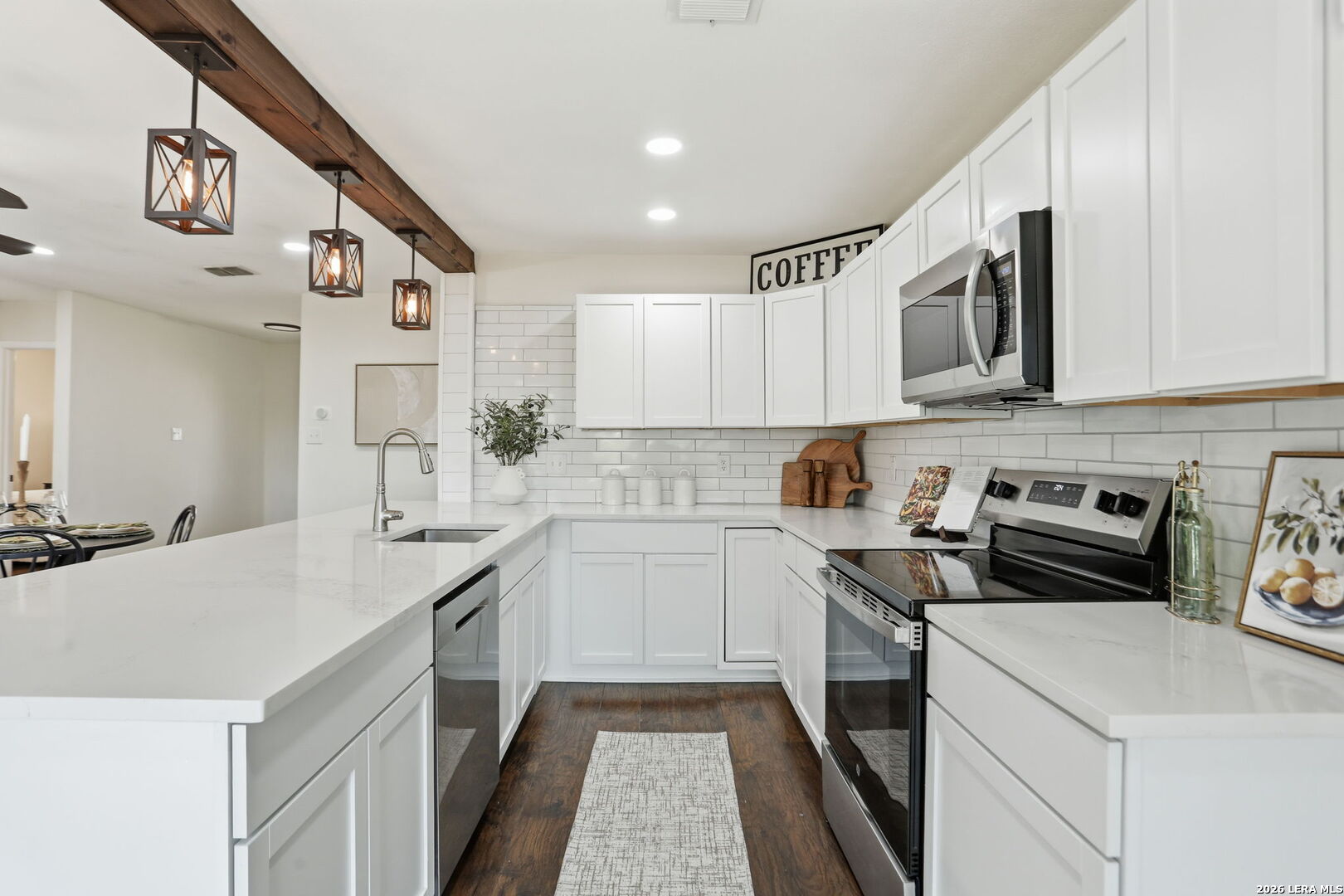 7106 Comanche Ridge Drive Converse, TX 78109 - Photo 22 of 36 a kitchen with a sink stove and cabinets