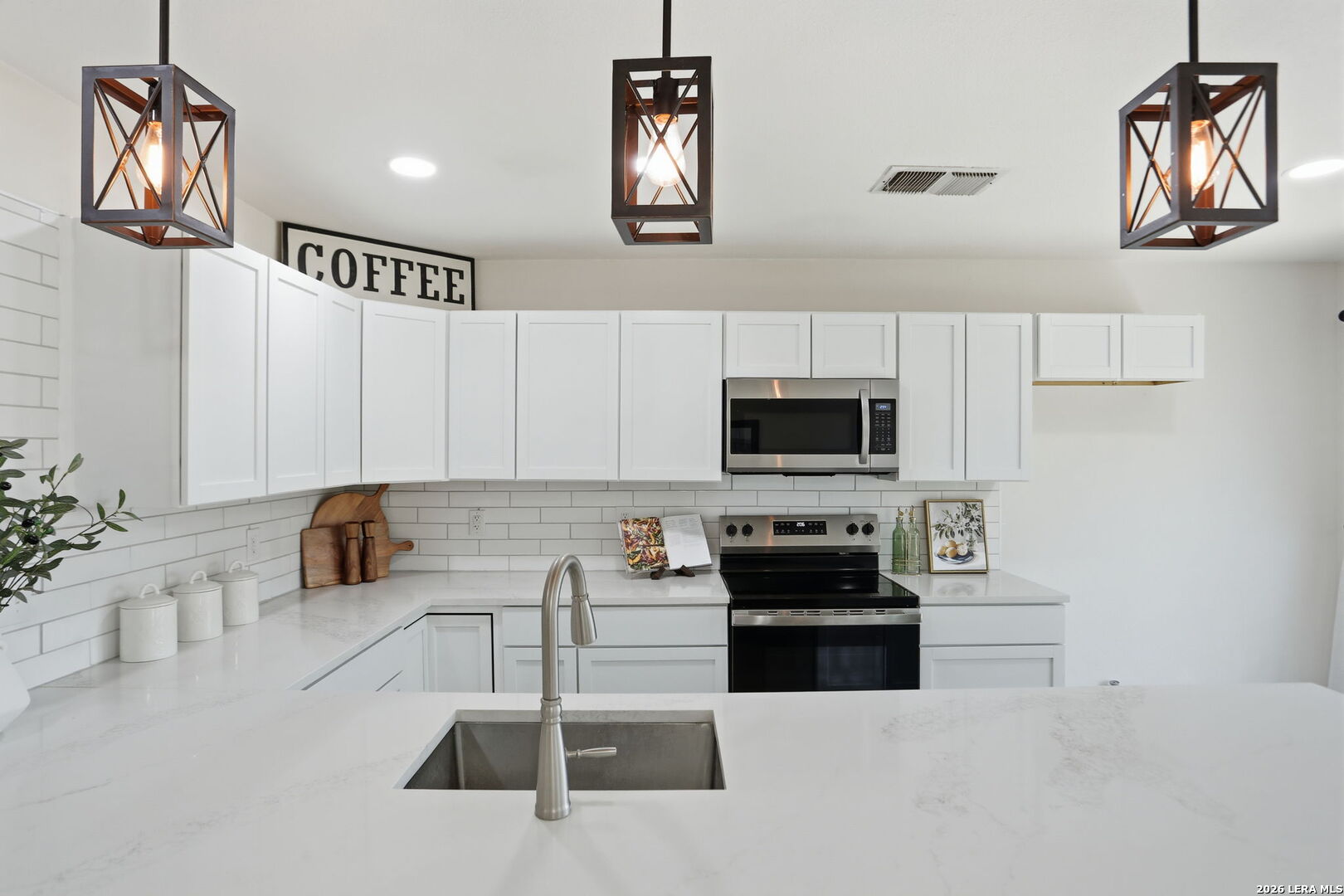 7106 Comanche Ridge Drive Converse, TX 78109 - Photo 23 of 36 a kitchen with a refrigerator and a stove top oven