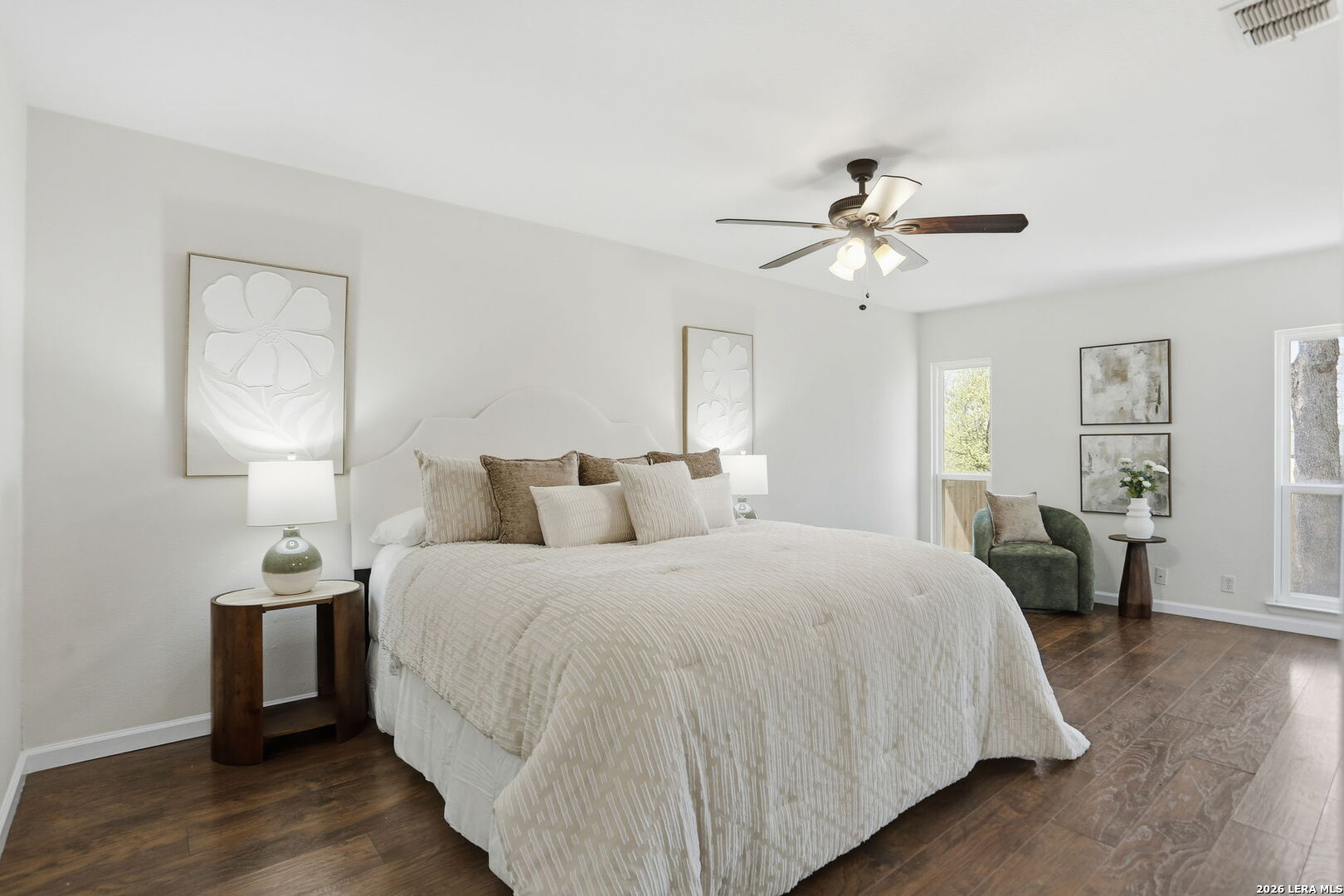 7106 Comanche Ridge Drive Converse, TX 78109 - Photo 24 of 36 a spacious bedroom with a bed and a chandelier