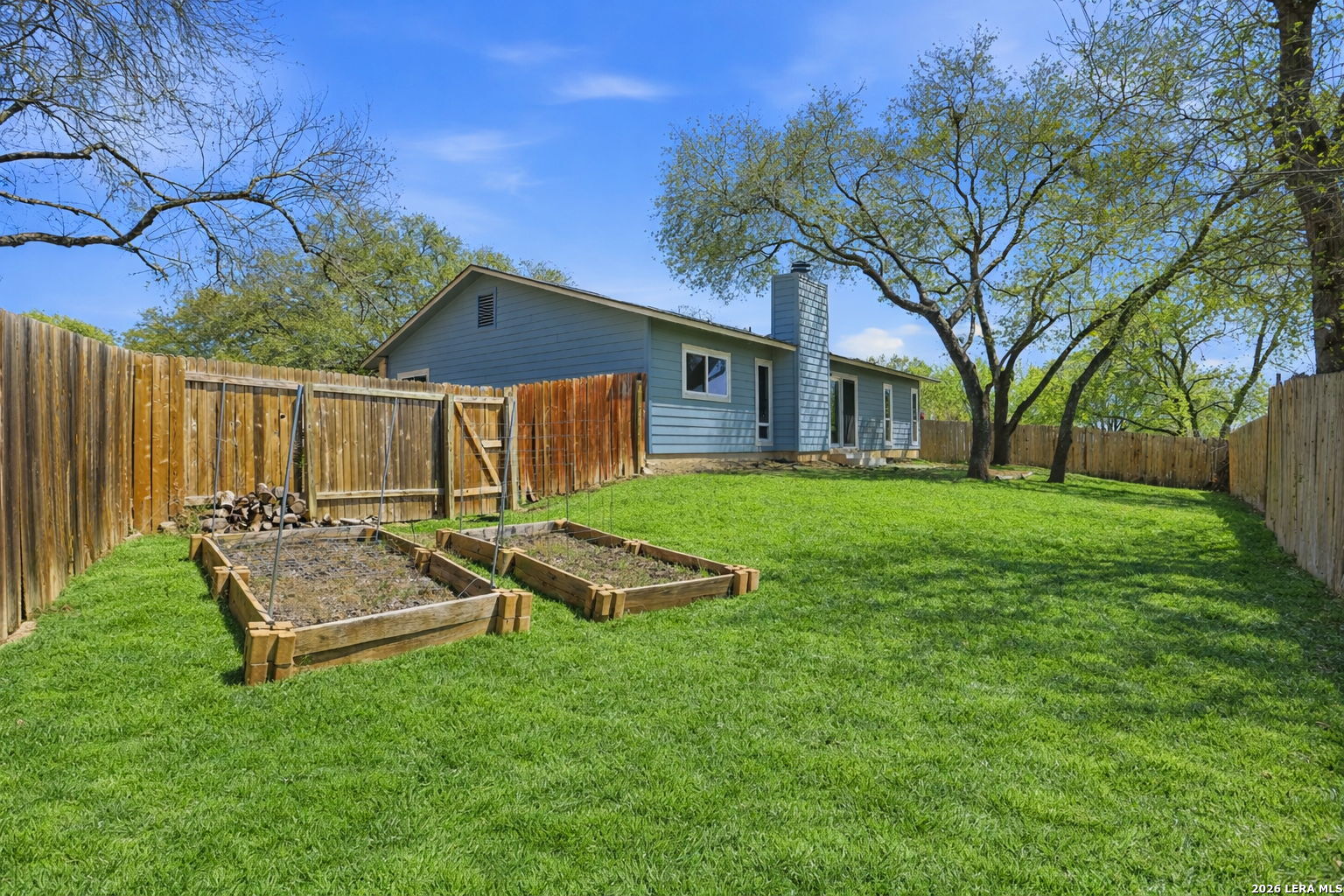 7106 Comanche Ridge Drive Converse, TX 78109 - Photo 32 of 36 a view of a house with backyard and a tree