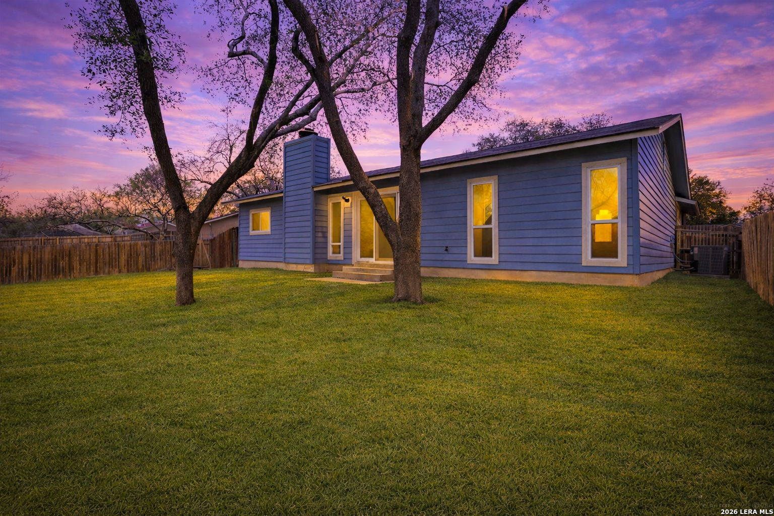 7106 Comanche Ridge Drive Converse, TX 78109 - Photo 35 of 36 a house with huge green field in front of it