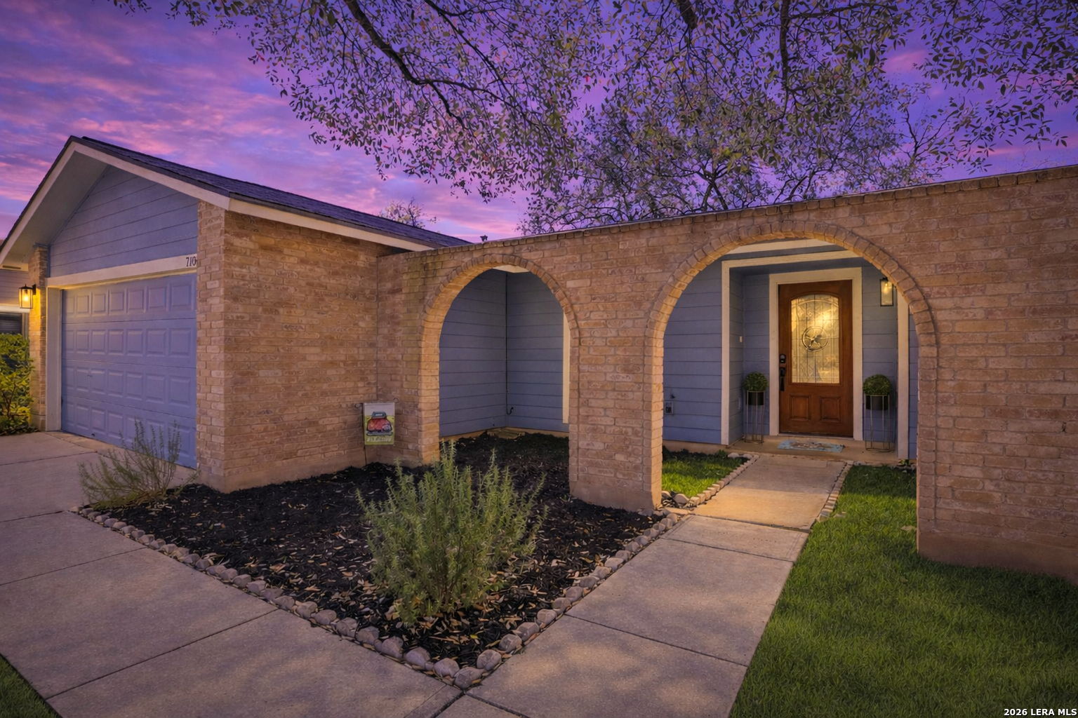 7106 Comanche Ridge Drive Converse, TX 78109 - Photo 6 of 36 a front view of a house with garden
