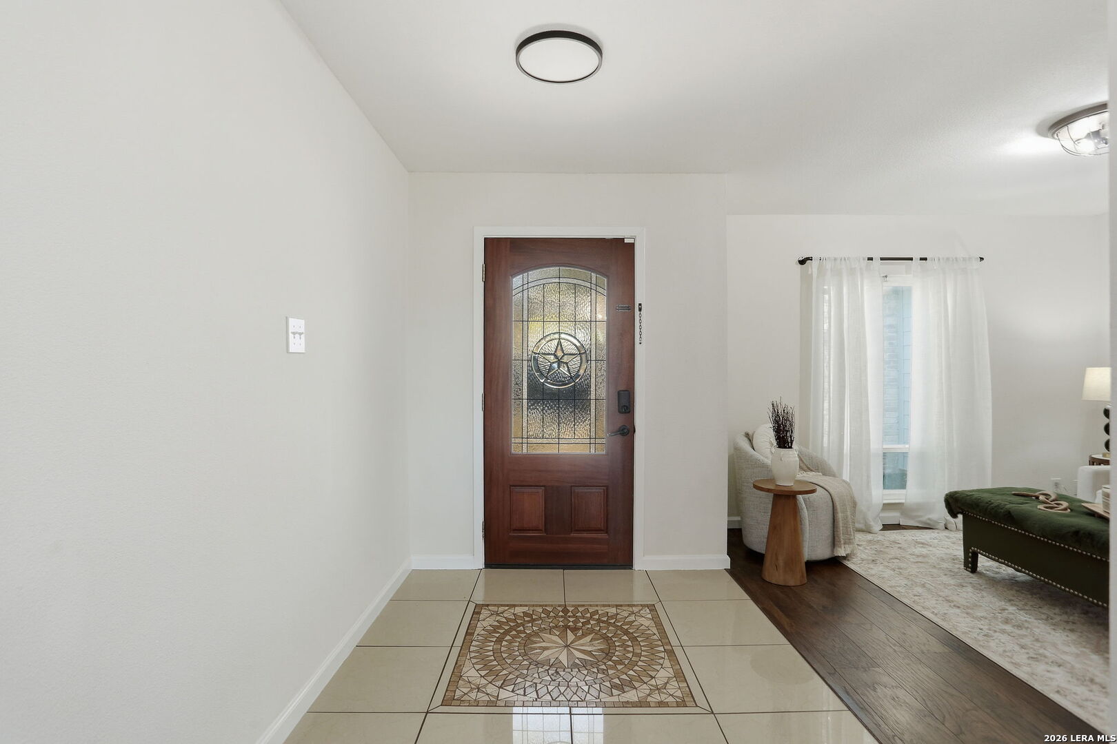 7106 Comanche Ridge Drive Converse, TX 78109 - Photo 10 of 36 a hallway with sliding door and bedroom with mirror