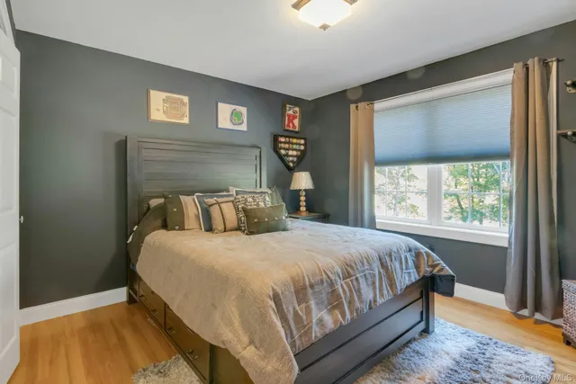 a bedroom with a bed and window