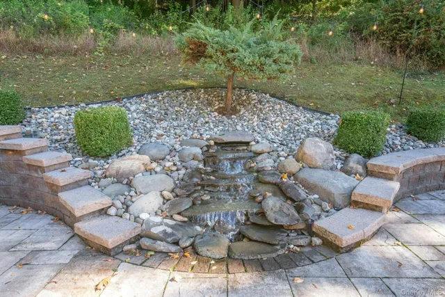 a view of a field with trees in the background