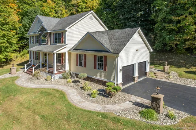an aerial view of residential house with outdoor space