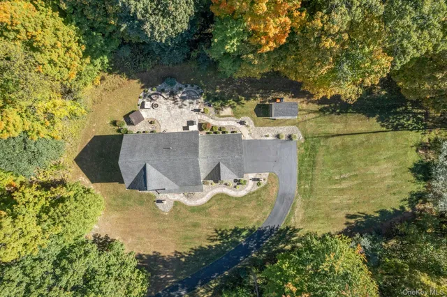 a view of a chairs and table in backyard