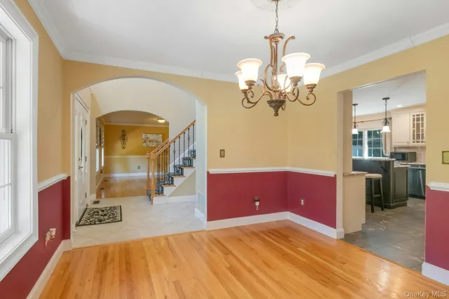 a bedroom with a bed and a mirror