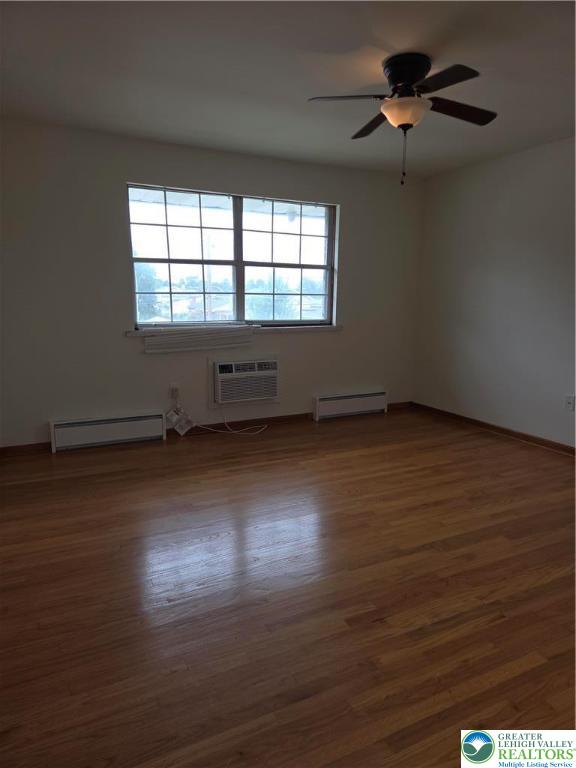 1204 Lewis Street, Unit 2E Bethlehem, PA 18017 - Photo 13 of 14 an empty room with wooden floor and windows