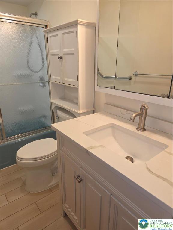 1204 Lewis Street, Unit 2E Bethlehem, PA 18017 - Photo 14 of 14 a bathroom with a sink a toilet and shower