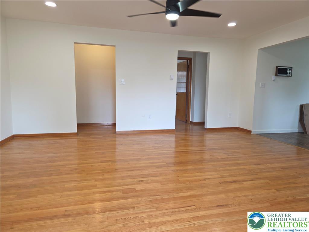 1204 Lewis Street, Unit 2E Bethlehem, PA 18017 - Photo 4 of 14 a view of an empty room with wooden floor