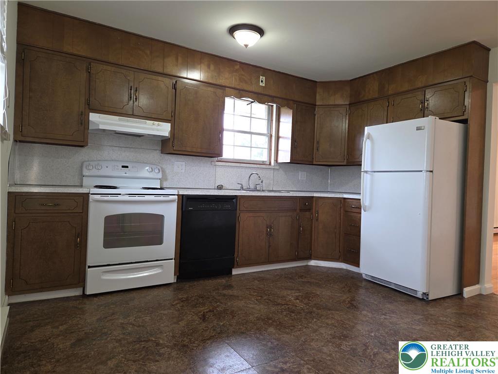 1204 Lewis Street, Unit 2E Bethlehem, PA 18017 - Photo 8 of 14 a kitchen with a sink a stove and refrigerator
