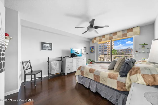 a bathroom with a granite countertop sink mirror vanity bathtub and a toilet