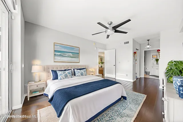 a bedroom with a bed chair and a window