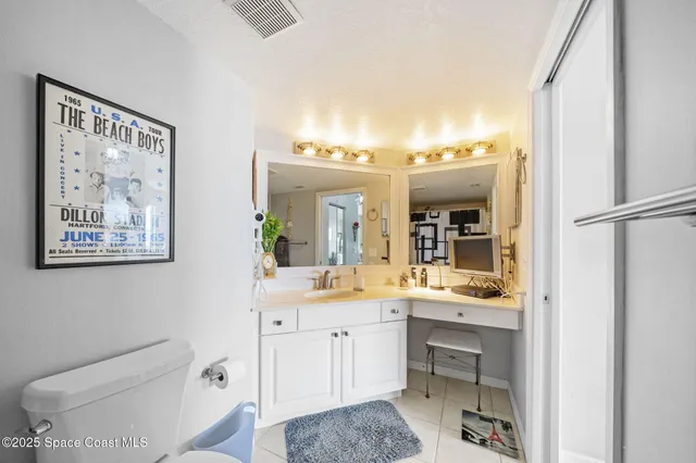 a bedroom with a bed chair and a window