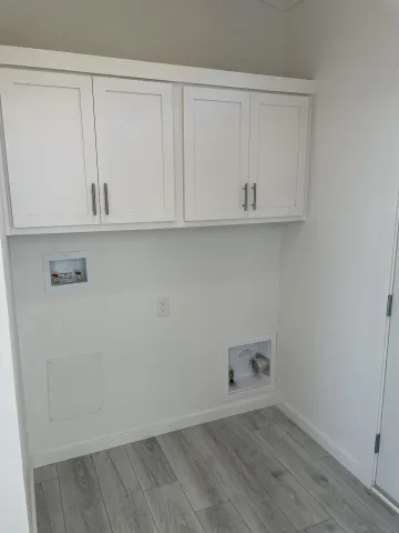 an empty room with cabinet
