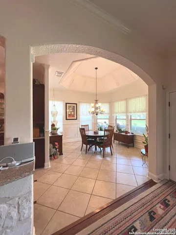 a view of a dining room with furniture and window