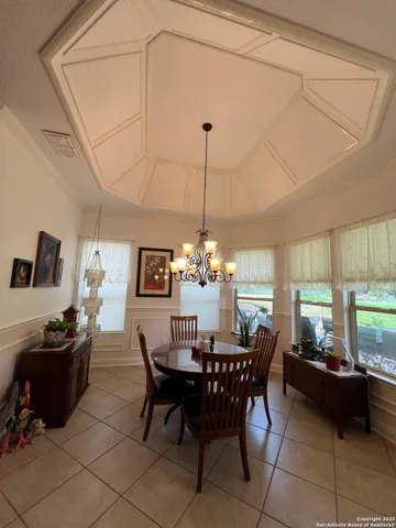a view of a dining room with furniture window and outside view