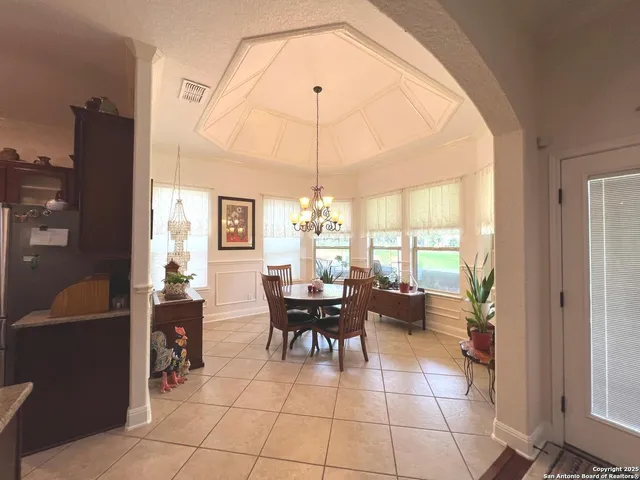 a view of a living room and dining area