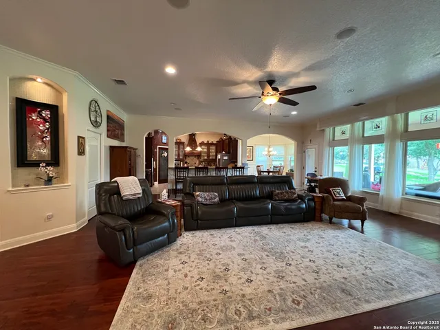 a spacious bedroom with a bed and a couch