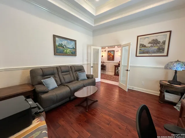 a blue bed sitting in a room next to a window