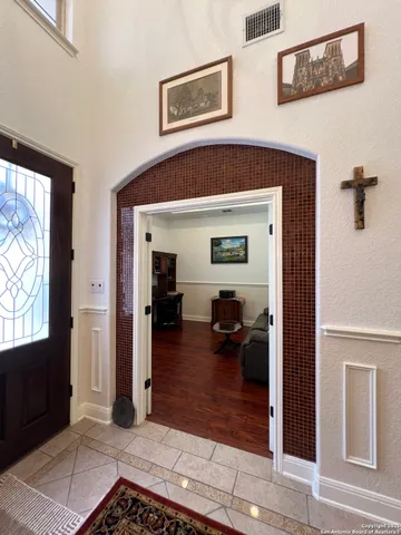 a large bathroom with a large tub and sink