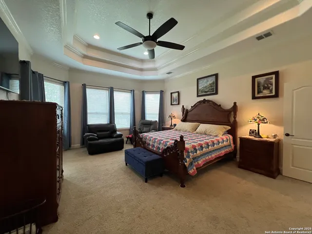 a bathroom with a toilet and a picture on the wall