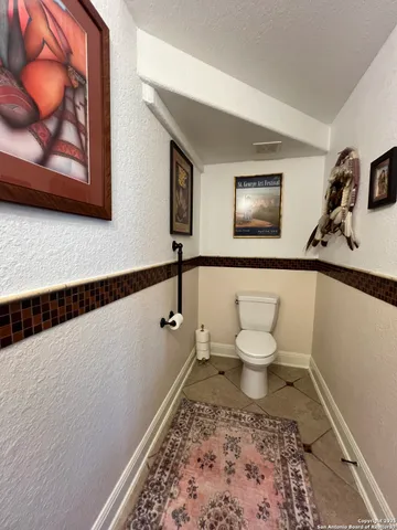 a bedroom with a bed and a flat screen television